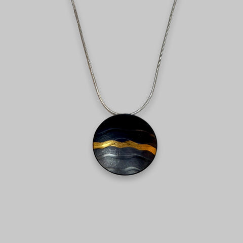 Sandra Elizabeth 'Round Wave Pendant' oxidised silver with one gold wave