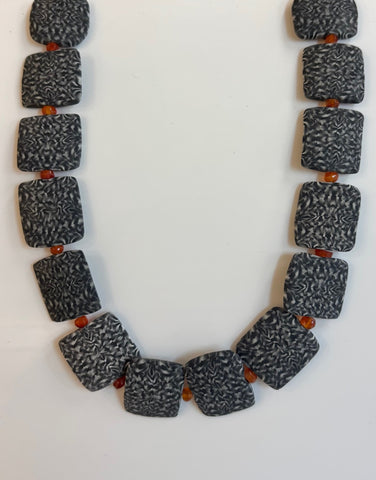 Crispin McNally 'Dark nerikomi ceramic necklace with orange beads' 43cm length