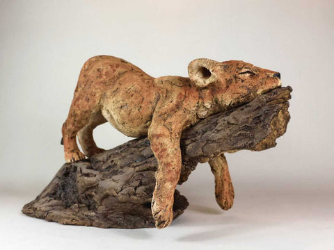 Julie Wilson 'Sleeping Lion Cub on a Log' ceramic