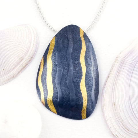 Sandra Elizabeth 'Sterling silver mussel form pendant with 24 carat gold wave, and oxidised finish' 40x53mm
